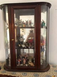 mirrored wood display case with curved glass sides