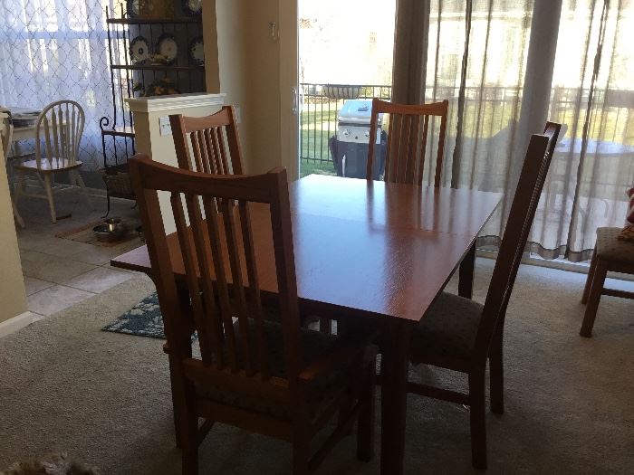 Mission Style dinning room table, with 6 upholstered chairs plus extension.