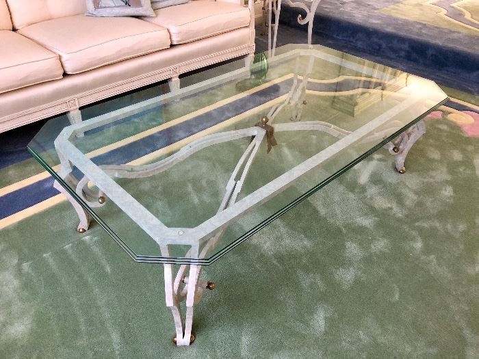 This glass top cocktail table matches the end tables.