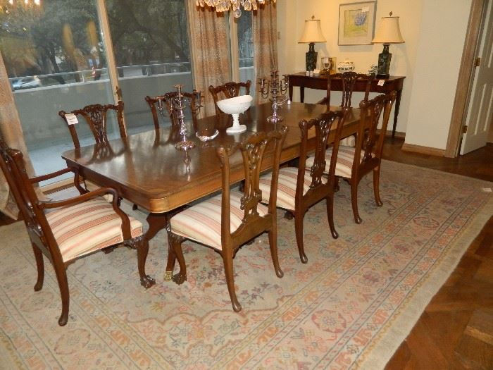 Double pedestal table with inlaid design.  TWELVE claw and ball Chippendale chairs.