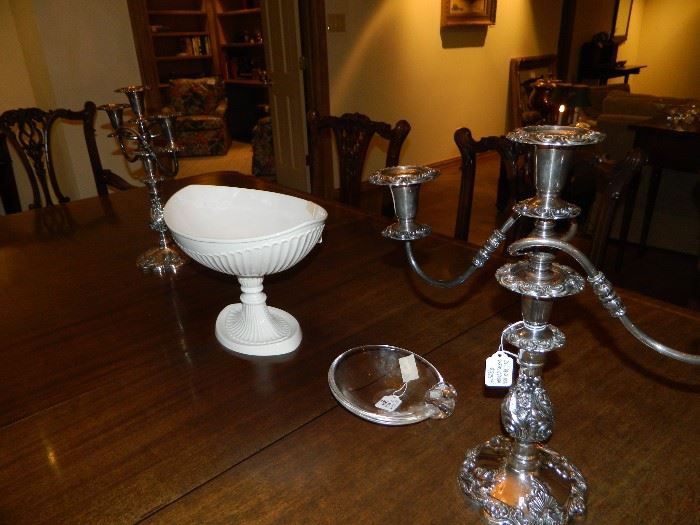 Centerpiece compote and pair of silver-plated three-point candelabra.