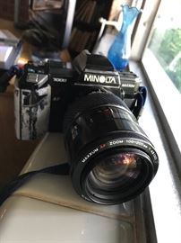 Minolta has several lenses. Some surface damage but lenses are good.