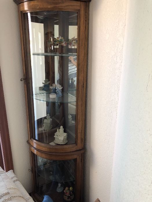 Curved glass corner curio cabinet 