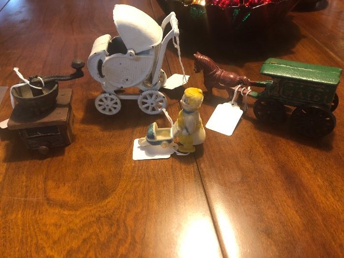 Vintage cast iron toys, plastic walking lady and buggy