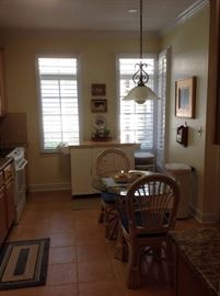 kitchen island and glass kitchen table and chairs
