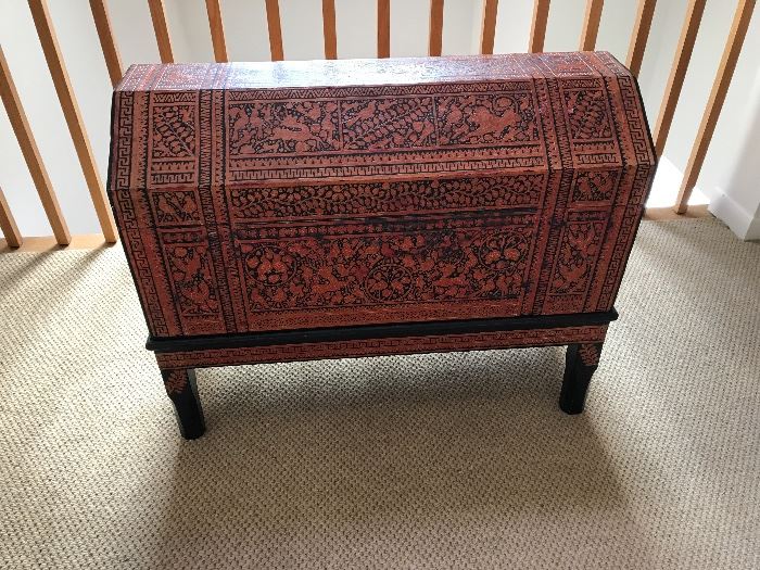 Carved wooden chest with tribal motif 