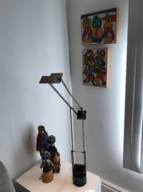 Assortment of art and tribal figures. Modern swing lamp 
