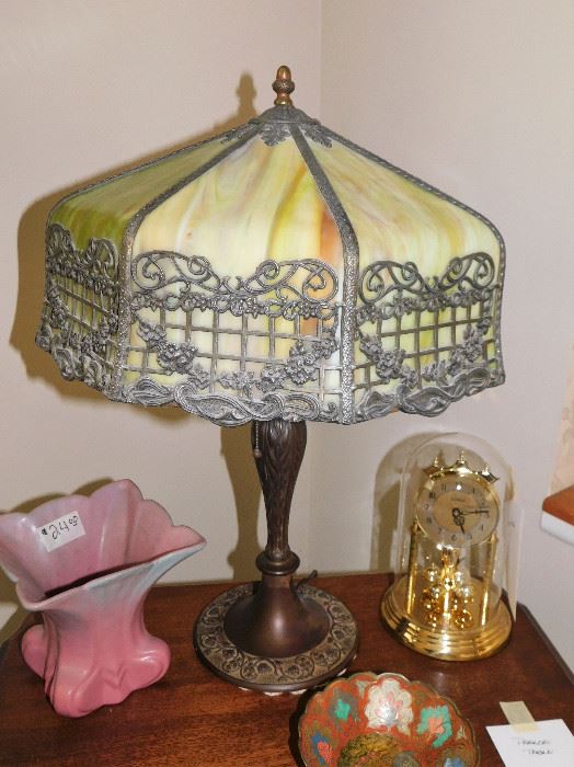 This one is a beauty. No cracks or chips that I can find on the shade. Excellent genuine Arts & Crafts lamp!