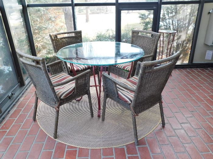 Nice patio table, 4 chairs, plant stand and outdoor rug.