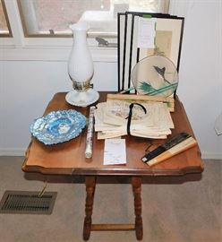 Very cute small drop-leaf table. Set of embroidered flatware bags with tablecloth.