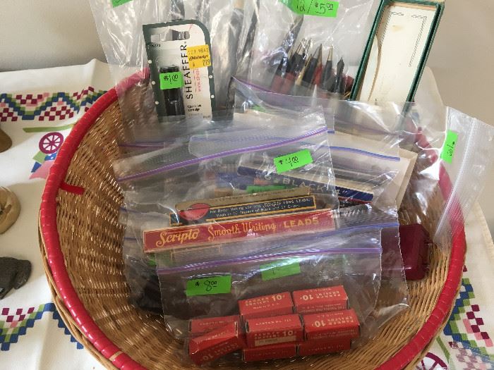 Many new-in-box mechanical pencil leads and erasers.