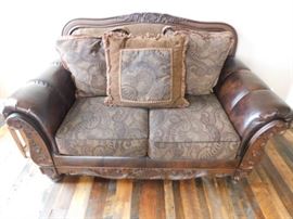 Nebraska Furniture mart Leather and Fabric Loveseat 