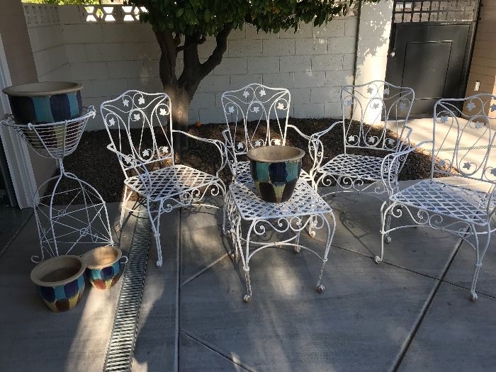 Vintage metal chairs and table and plant stand