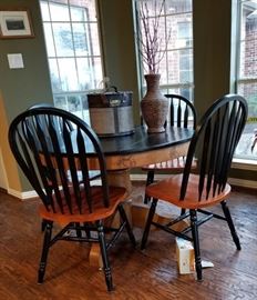 Small round table. 4 spindle back chairs