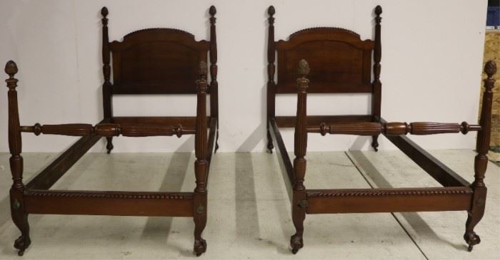 Matching pair carved poster twin beds