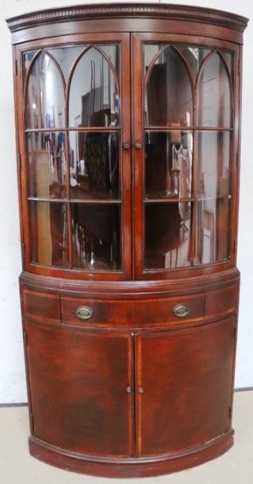 Bow front mahogany corner cabinet by Fancher