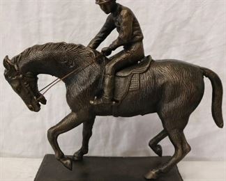 Bronze polo statue