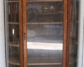 Original finish oak bow glass cabinet