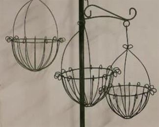 Green pole with baskets