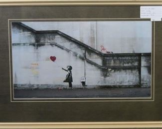 Girl with Balloon by graffitie artist Banksy