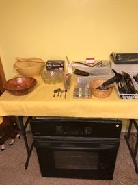 Serving bowls, butter warming stand, serving utensils, wall oven, knives, silver ware