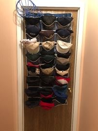 Baseball caps, all different kinds, some with tags.