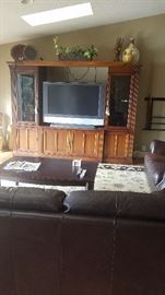 Wide screen flat TV entertainment center in 3  sections