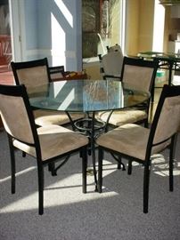 Stunning iron and glass round table, with 4 upholstered chairs