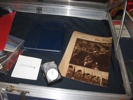 Old newspapers, stop watch, coins, and more