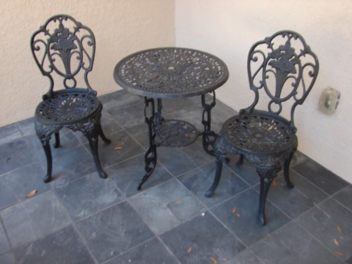 Cast Iron Table and Chairs. $60.00