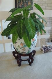 Large oriental design pot with faux plant.
