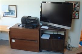 HDTV, stand and file cabinet.