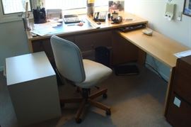 Corner computer desk unit and desk chair.