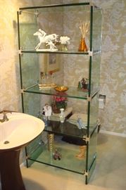 Glass etagere and items on shelves including Weller vase & Kieser bisque porcelain.