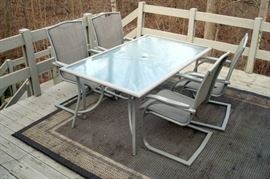 Heavy duty aluminum patio furniture. Table comes with umbrella and weighted holder.