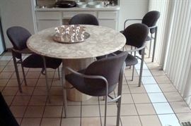 Marble top table and five chairs.