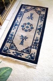 Oriental hand knotted wool rug.