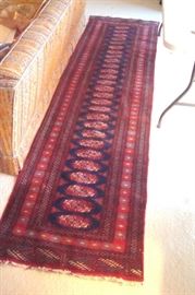 Semi antique wool hand knotted Bokara Persian runner.
