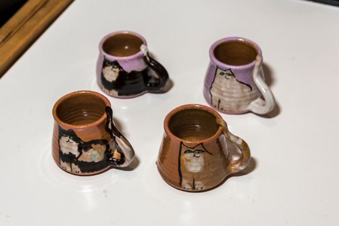 Pottery mugs with cats.