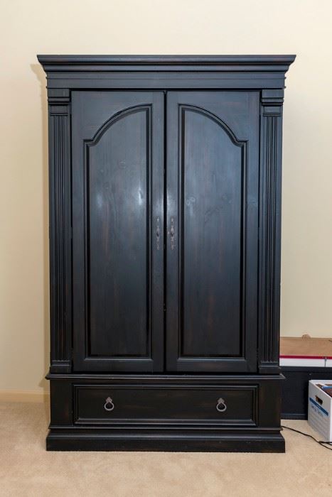 Black Armoire or entertainment cabinet.