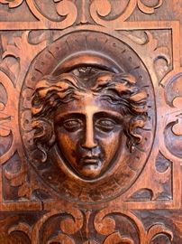 Close-up of antique French oak hand carved cabinet.