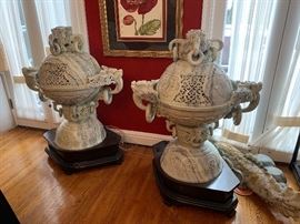 Huge carved censors. The owner has installed light fixtures inside to create an even greater dramatic effect from these monumental pieces.