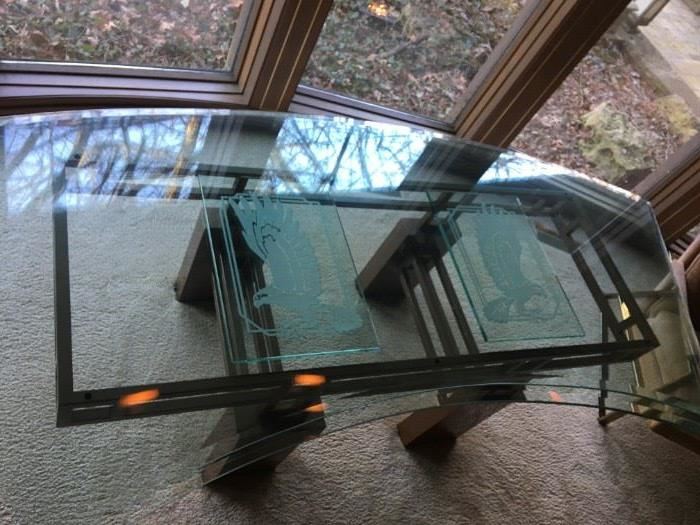 Fabulous curved glass desk on a heavy metal painted base. Eagle figures are etched into the glass top.