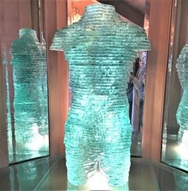 Life sized green glass slab torso sculpture.