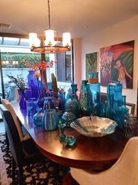 10 Foot Wood Dinning table with an ensemble of dinning chairs