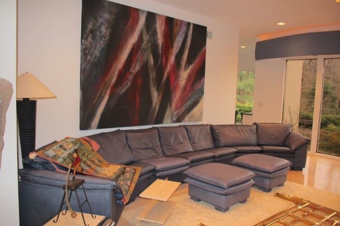 Large Leather Sectional and Art with Ottomans and Floor Lamp