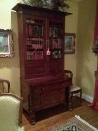 Ca. 1840 Empire/Classical Secretary with flaming buttress cornice with carved feet and acanthus carved pilasters on the base.