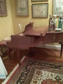 Mahogany Baby Grand Piano by Kimball. Sound condition with ivory keys.