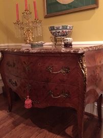 Late 19th Century Classic Louis XV bombe marquetry commode with marble top and ormolu.