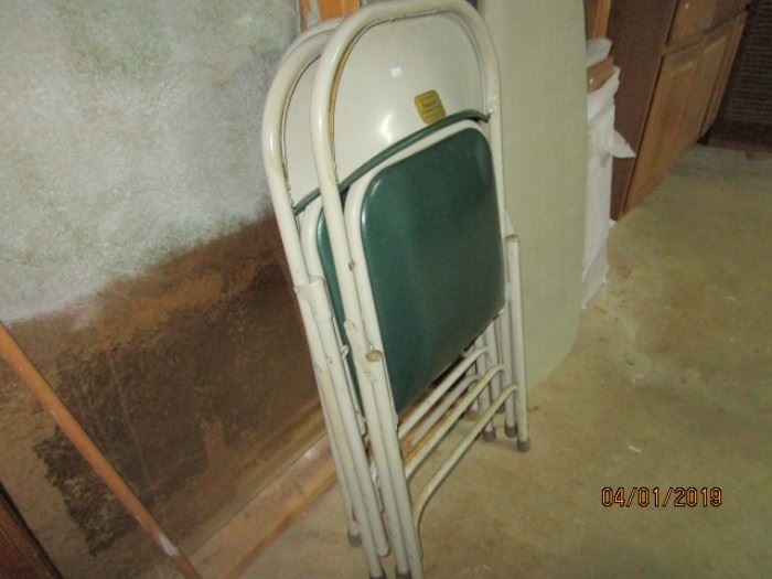 two of four folding chairs